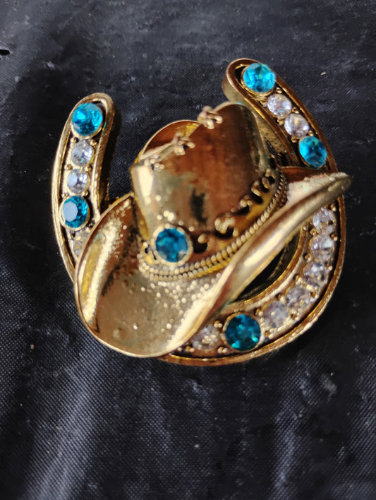 Cowboy hat in a horse shoe pin